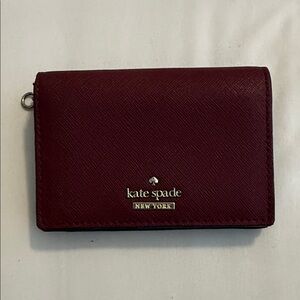 kate spade deep burgundy leather card wallet with gold-tone hardware